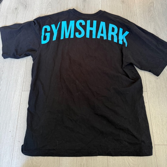 Gymshark Tops - Gymshark Black Oversized Tee with Vibrant Blue Lettering